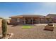 Spacious backyard with desert landscaping, covered patio and room for entertaining at 2842 S Royal Wood --, Mesa, AZ 85212