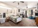 Large bedroom with neutral walls, carpet, guitars, banjos, and a desk at 2842 S Royal Wood --, Mesa, AZ 85212