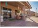 Covered patio featuring brick pavers, exterior lights, and cozy patio furniture at 2842 S Royal Wood --, Mesa, AZ 85212