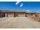 Charming single-story home showcasing a three car garage, neutral color palette and low maintenance desert landscaping at 2842 S Royal Wood --, Mesa, AZ 85212