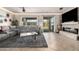 Inviting living room offering modern fireplace, plush seating, and bright natural light from sliding glass doors at 2842 S Royal Wood --, Mesa, AZ 85212