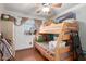 Cozy bedroom featuring bunk beds, a ceiling fan, natural light, and tiled floor at 306 N Winthrop Cir, Mesa, AZ 85213