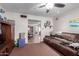 Spacious living room with carpet flooring, comfortable sofa, and a view into the dining area at 306 N Winthrop Cir, Mesa, AZ 85213