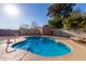 Sparkling pool, spacious concrete patio, and secure fencing make this backyard an oasis at 306 N Winthrop Cir, Mesa, AZ 85213