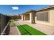 Paver patio with artificial turf off the back of the house at 32297 N 133Rd Ln, Peoria, AZ 85383