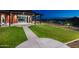 Expansive backyard with lush green lawn and covered patio area at 32297 N 133Rd Ln, Peoria, AZ 85383