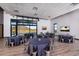 Well-lit event space with round tables, chairs, and scenic views at 32297 N 133Rd Ln, Peoria, AZ 85383