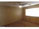 Bedroom with tan colored walls, carpeted floors, and a ceiling fan at 39837 N Manetti St, San Tan Valley, AZ 85140