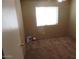 Neutral bedroom featuring a bright window, neutral carpeting, and a closet at 39837 N Manetti St, San Tan Valley, AZ 85140