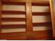 Open wooden shelving in cabinets offers plenty of storage and organization at 39837 N Manetti St, San Tan Valley, AZ 85140