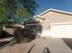 Inviting single-level home featuring a two-car garage, gravel landscaping, and a walkway to the front door at 39837 N Manetti St, San Tan Valley, AZ 85140