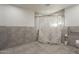 Bathroom with tiled walls, a shower behind a curtain, and safety handrails at 40192 N Taylor St, San Tan Valley, AZ 85140