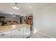Bright kitchen with an island counter with wood surface and a view to the living room at 40192 N Taylor St, San Tan Valley, AZ 85140