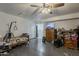 Living room with ceiling fan, access to bathroom, and a TV at 40192 N Taylor St, San Tan Valley, AZ 85140