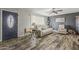 Cozy living room with modern floors, ceiling fan, and comfortable white sofa at 40192 N Taylor St, San Tan Valley, AZ 85140