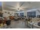 Large living room with ceiling fan, and filled with clutter and equipment at 40192 N Taylor St, San Tan Valley, AZ 85140