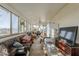 Sun room with a couch, TV, and lots of windows at 40192 N Taylor St, San Tan Valley, AZ 85140