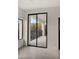 Bright room with a large sliding glass door to balcony, with black trim and tile floor at 40198 N 105Th Pl, Scottsdale, AZ 85262