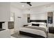 Inviting primary bedroom with modern furnishings, a fireplace and stylish decor at 40198 N 105Th Pl, Scottsdale, AZ 85262