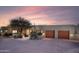 Beautiful exterior of a modern home with desert landscaping and a two-car garage at 40198 N 105Th Pl, Scottsdale, AZ 85262