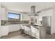 Modern kitchen with a large center island, updated appliances, and breakfast bar seating at 40198 N 105Th Pl, Scottsdale, AZ 85262