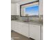 Bright kitchen with stainless steel sink and a great view from the large picture window at 40198 N 105Th Pl, Scottsdale, AZ 85262