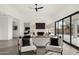 Comfortable living room with fireplace, modern decor, and an expansive view of the desert landscape at 40198 N 105Th Pl, Scottsdale, AZ 85262