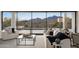 Bright living room with comfortable white sofas, mountain views, and large windows at 40198 N 105Th Pl, Scottsdale, AZ 85262