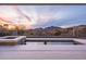 Spectacular pool view with desert scenery, framed by a breathtaking sunset backdrop at 40198 N 105Th Pl, Scottsdale, AZ 85262