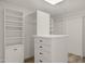 Spacious walk-in closet features custom shelving and storage solutions at 40198 N 105Th Pl, Scottsdale, AZ 85262