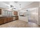 The kitchen features ample countertops, a stainless steel sink, a window, and an archway at 40360 W Hayden Dr, Maricopa, AZ 85138