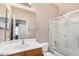 Standard bathroom with a single sink and a shower behind glass door at 41848 W Michaels Dr, Maricopa, AZ 85138