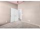 Neutral bedroom with a standard closet, carpet floors and access to a door at 41848 W Michaels Dr, Maricopa, AZ 85138