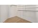 Walk-in closet with built-in shelving and a clothes rod at 41848 W Michaels Dr, Maricopa, AZ 85138