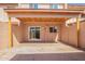 Backyard with a covered patio, concrete, and sliding glass doors at 4625 W Thomas Rd # 19, Phoenix, AZ 85031