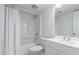 A clean bathroom features a shower-tub combo, white tile, and a vanity at 4625 W Thomas Rd # 19, Phoenix, AZ 85031