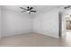 Bright, clean bedroom with neutral carpet, white walls, and a ceiling fan at 4625 W Thomas Rd # 19, Phoenix, AZ 85031