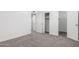 This bedroom includes neutral walls, carpet, and a closet at 4625 W Thomas Rd # 19, Phoenix, AZ 85031