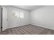 This bedroom has neutral walls and carpet, plus a window for natural light at 4625 W Thomas Rd # 19, Phoenix, AZ 85031