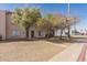 Street view of townhomes with desert landscaping, mature trees and sidewalks at 4625 W Thomas Rd # 19, Phoenix, AZ 85031