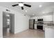 Bright kitchen features stainless steel appliances, white cabinetry and tiled floors at 4625 W Thomas Rd # 19, Phoenix, AZ 85031