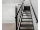 Modern staircase with metal railings in a well-lit interior at 4625 W Thomas Rd # 19, Phoenix, AZ 85031