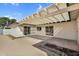 Back patio with lattice covering, sliding doors, and low maintenance landscaping at 4743 W Laurel Ln, Glendale, AZ 85304