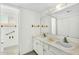 Bright bathroom with a double sink vanity, large mirror, and ample counter space at 4743 W Laurel Ln, Glendale, AZ 85304