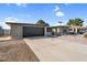 Charming single-story home featuring a spacious driveway and a two-car garage at 4743 W Laurel Ln, Glendale, AZ 85304