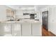 Bright kitchen with white cabinets, stainless steel appliances, and ample counter space at 4743 W Laurel Ln, Glendale, AZ 85304