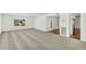 Spacious living room featuring plush carpeting and lots of natural light from a large window at 4743 W Laurel Ln, Glendale, AZ 85304