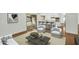 Bright living room featuring wood floors, a large sliding door, and neutral furnishings at 4743 W Laurel Ln, Glendale, AZ 85304
