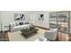 Cozy living room with wood floors, neutral furniture, and sliding glass door at 4743 W Laurel Ln, Glendale, AZ 85304