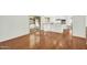 Open-concept living area with gleaming hardwood floors and access to the backyard at 4743 W Laurel Ln, Glendale, AZ 85304